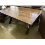 An early 20th century rectangular oak X frame refectory dining table, length 167cm, depth 80cm,