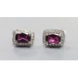 A pair of white metal (stamped 375), garnet and diamond set rectangular cluster ear studs, 8mm,