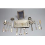 An 800 white metal stand, 16.4cm, twelve items of assorted silver flatware, a silver napkin ring,