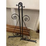 A pair of black painted wrought iron wall mounting brackets, width 114cm, height 54cm