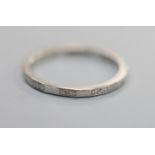 A shape white metal ( stamped platinum) wedding band, size M, 3.3 grams.