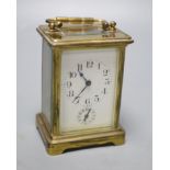 A late 19th century French brass cased eight day carriage timepiece with incorporated alarm,