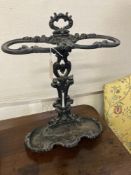 A Victorian style black painted cast iron stick and umbrella stand, width 45cm, depth 18cm, height