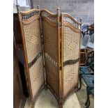 A three fold bamboo and rattan dressing screen, height 186cm