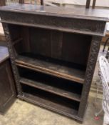 A late Victorian carved oak open bookcase, length 92cm, depth 31cm, height 115cm