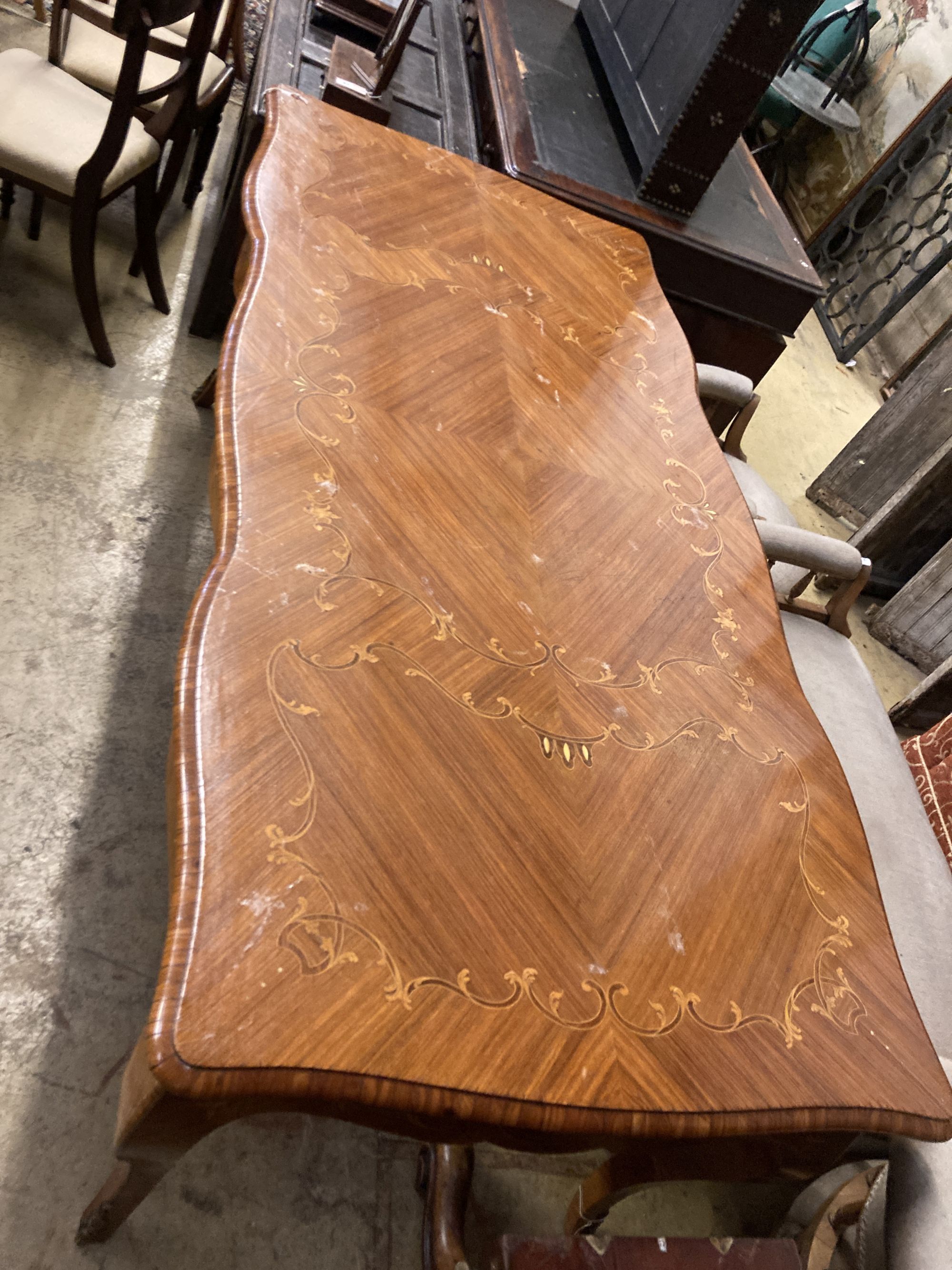 A Louis XVI design marquetry inlaid kingwood serpentine centre table W.196cm. D 90cm. H 79cm. - Image 2 of 6