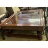 A reproduction walnut glass top square coffee table, 103cm, height 46cm