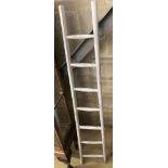 A vintage white painted wood seven tread ladder, width 30cm, height 170cm