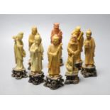 A set of soapstone carvings of the Eight Immortals, early 20th century, in varied colour of stone,