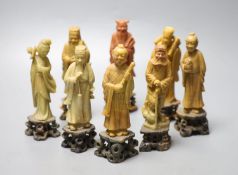 A set of soapstone carvings of the Eight Immortals, early 20th century, in varied colour of stone,