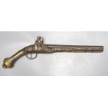A 19th century Ottoman carved wood and brass mounted flintlock pistol, length 45cm