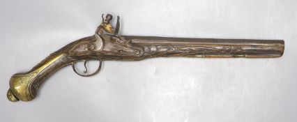A 19th century Ottoman carved wood and brass mounted flintlock pistol, length 45cm