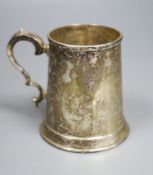 A George VI silver mug, Cooper Brothers & Sons, Sheffield, 1942, 12.2cm, 11oz.CONDITION: Quite