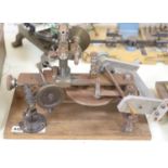 Watch & Clockmakers tools - a steel bushing? tool, wood plinth, 39.5cm and other various