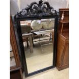 A 19th century French ebonised wall mirror, width 86cm, height 158cm