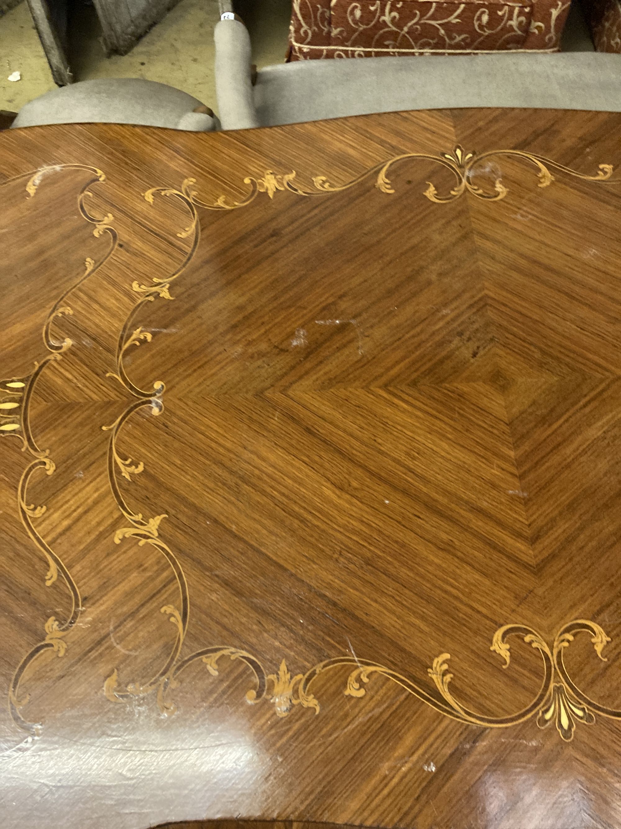 A Louis XVI design marquetry inlaid kingwood serpentine centre table W.196cm. D 90cm. H 79cm. - Image 5 of 6