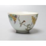 An unusual Japanese Kinkozan porcelain tea bowl, six character mark to base, painted with a bird