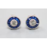 A pair of white metal (stamped China EJI) diamond and synthetic sapphire? set circular cluster