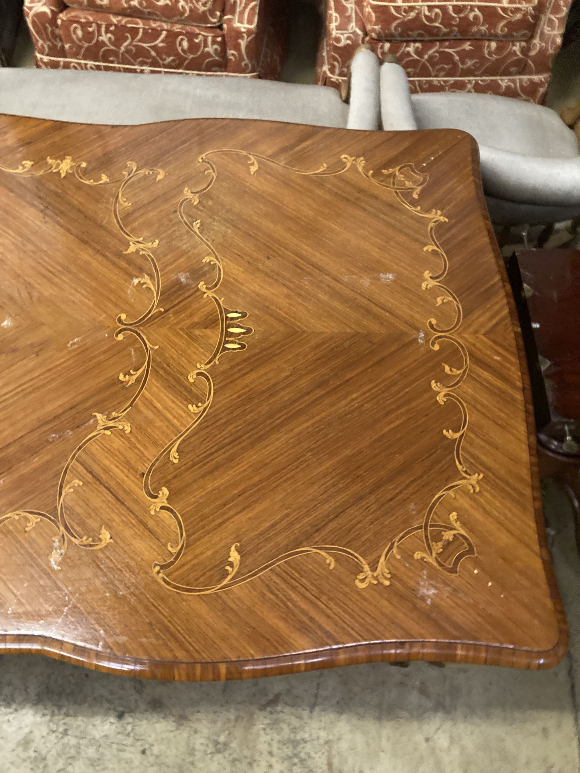 A Louis XVI design marquetry inlaid kingwood serpentine centre table W.196cm. D 90cm. H 79cm. - Image 6 of 6