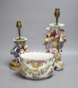 A Potschappel porcelain figural lamp, another similar lamp and a Dresden bowl with swags of flowers,