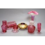 Six pieces of cranberry glass and a later bohemian ashtray, tallest 21cm