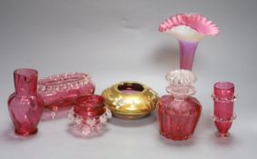 Six pieces of cranberry glass and a later bohemian ashtray, tallest 21cm