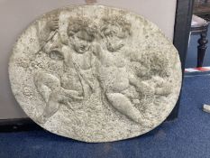 An oval reconstituted stone plaque, width 68cm, height 60cm