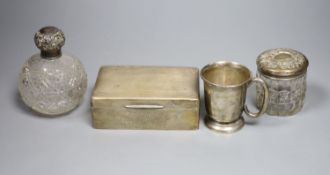 A George VI silver christening mug, a silver mounted cigarette box, a silver mounted scent bottle