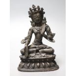 A Chinese or Sino-Tibetan bronze seated Buddha, possibly 18th century, height 16.5cm
