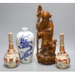 A pair of Satsuma bottle vases, a Chinese blue and white 'dragon' vase, 22cm, and a hardwood carving