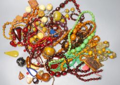 A group of assorted costume jewellery including faux amber etc.