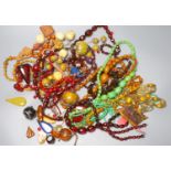 A group of assorted costume jewellery including faux amber etc.