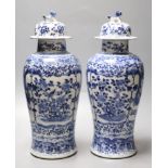 A pair of Chinese blue and white baluster vases and covers, Kangxi marks, late 19th century, 39.