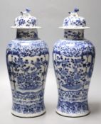 A pair of Chinese blue and white baluster vases and covers, Kangxi marks, late 19th century, 39.