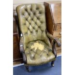 An early Victorian mahogany library armchair, upholstered in pale green leather, width 59cm, depth