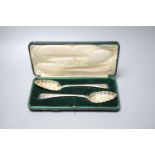 A pair of George III later embossed Old English pattern berry spoons, John Lias, London, 1817, 22.