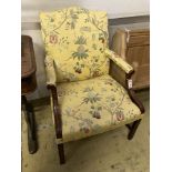 A George III style mahogany "Gainsborough" armchair, upholstered in a yellow ground fabric, width