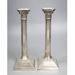 A pair of modern silver candlesticks, with panelled stems, A. Taite & Sons Ltd, London, 1957, height