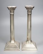 A pair of modern silver candlesticks, with panelled stems, A. Taite & Sons Ltd, London, 1957, height