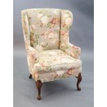 A French Hepplewhite style wing armchair together with a matching contemporary footstool