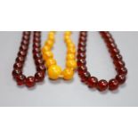 Two faux amber necklaces, 148cm and 44cm.