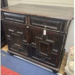 A Jacobean oak cupboard, fitted with a pair of doors, width 111cm, depth 60cm, height 102cm