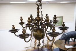 A 17th century style Dutch design brass six branch two tier ceiling chandelier