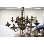 A 17th century style Dutch design brass six branch two tier ceiling chandelier