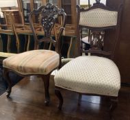 A pair of Victorian walnut dining chairs, on cabriole legs