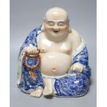 A Chinese porcelain figure of Budai, height 26cm