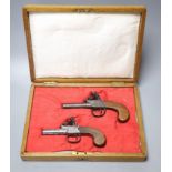 Two 19th century Dunderdale, Mabson & Labron steel flintlock pocket pistols, turn off barrels and