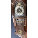 A wall clock with painted dial, height 132cm