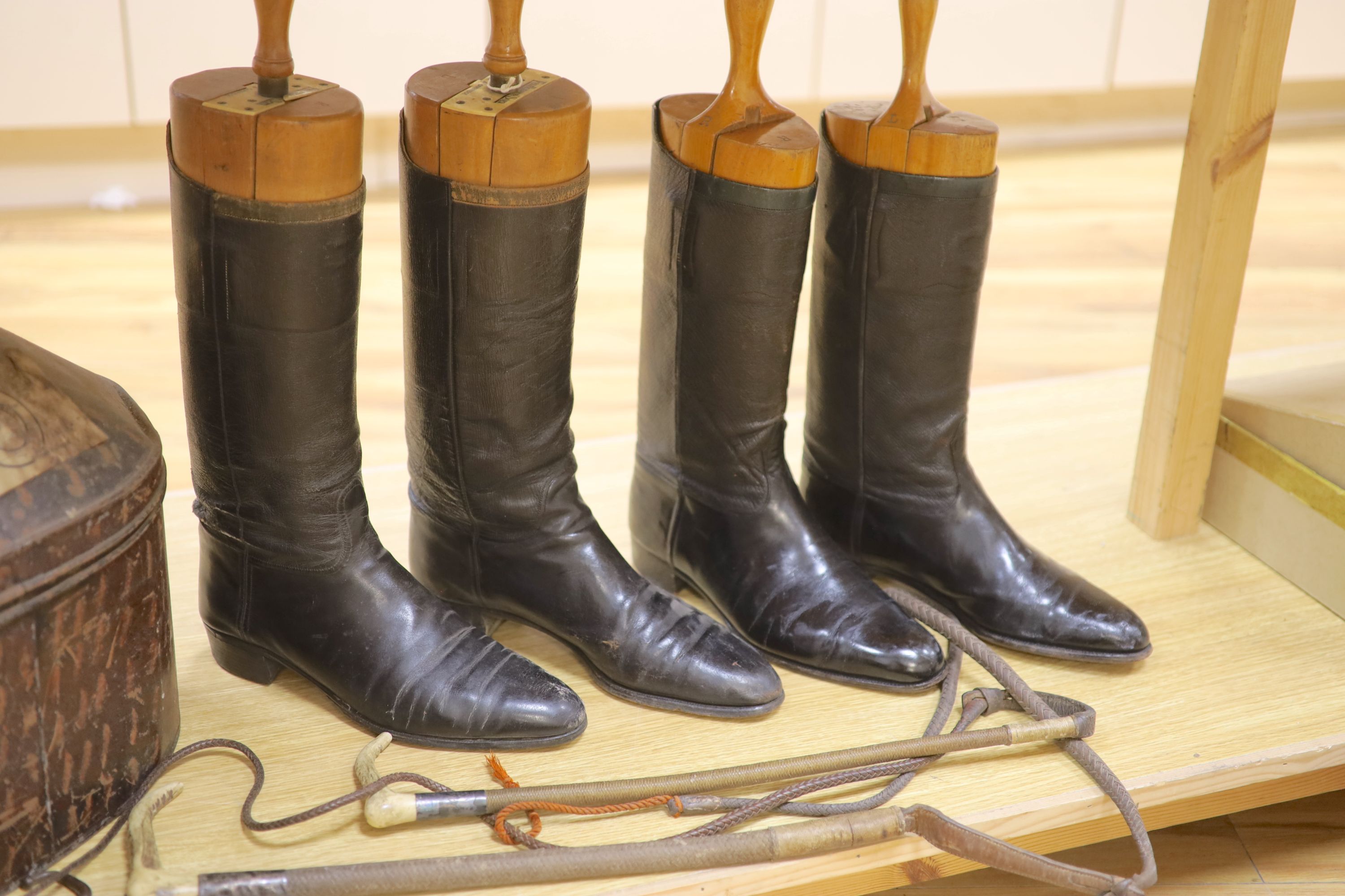 Two pairs of riding boots and trees together with two boot pulls and riding crops and a toleware hat - Image 4 of 4