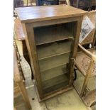 An oak and pine glazed music cabinet, glass fronted door with key, six shelves, width 52cm, depth